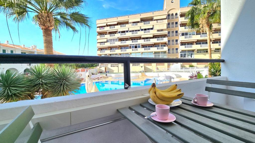 a bunch of bananas sitting on a table on a balcony at Aguaviva apartment in Callao Salvaje