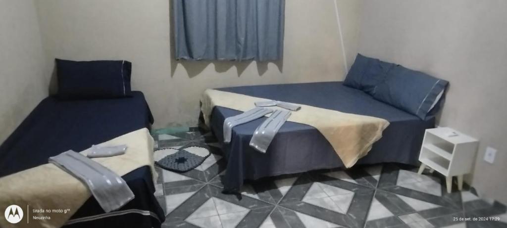 Ένα ή περισσότερα κρεβάτια σε δωμάτιο στο Ampla casa com acesso ao Rio