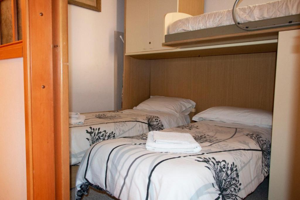 Postel nebo postele na pokoji v ubytování Vintage Flat Ligurian's style