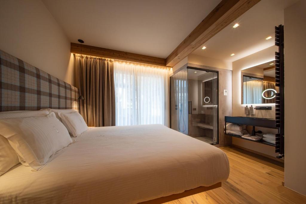 Postel nebo postele na pokoji v ubytování Hotel San Lorenzo
