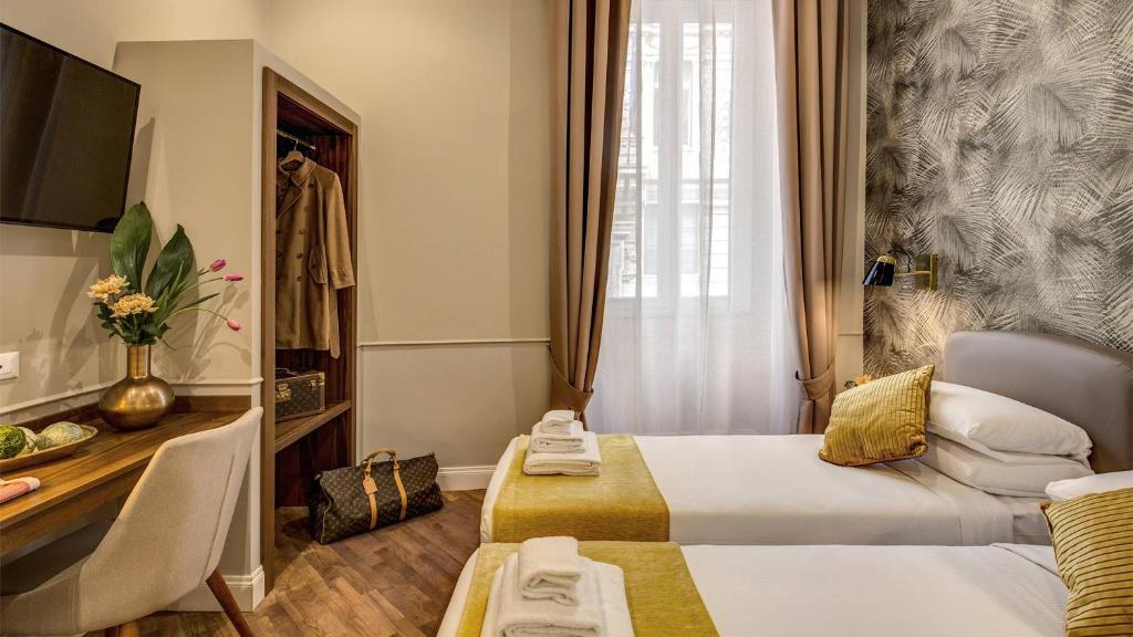 Postel nebo postele na pokoji v ubytování Charme Spagna Boutique Hotel