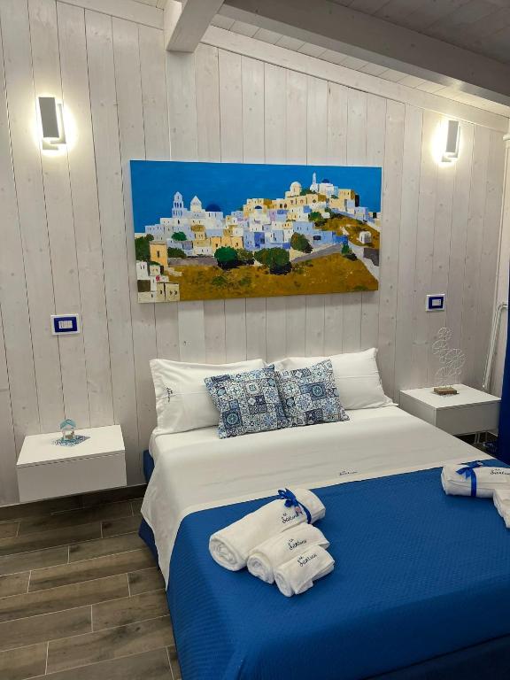 Giường trong phòng chung tại B&B Santorini