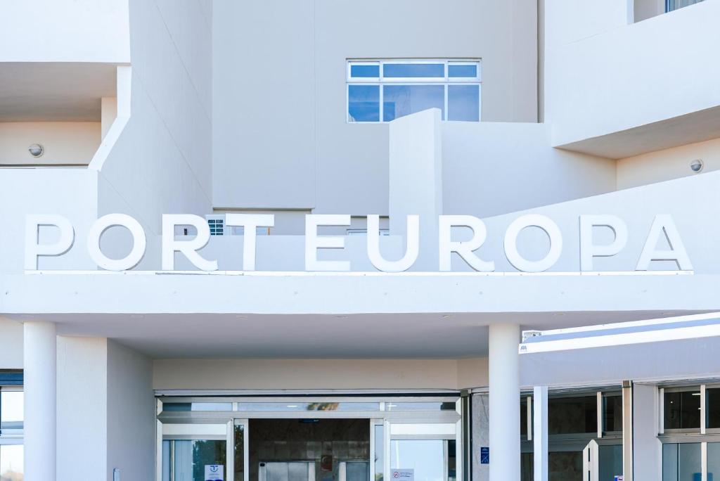 a white building with the sign for portefuri at Port Europa in Calpe
