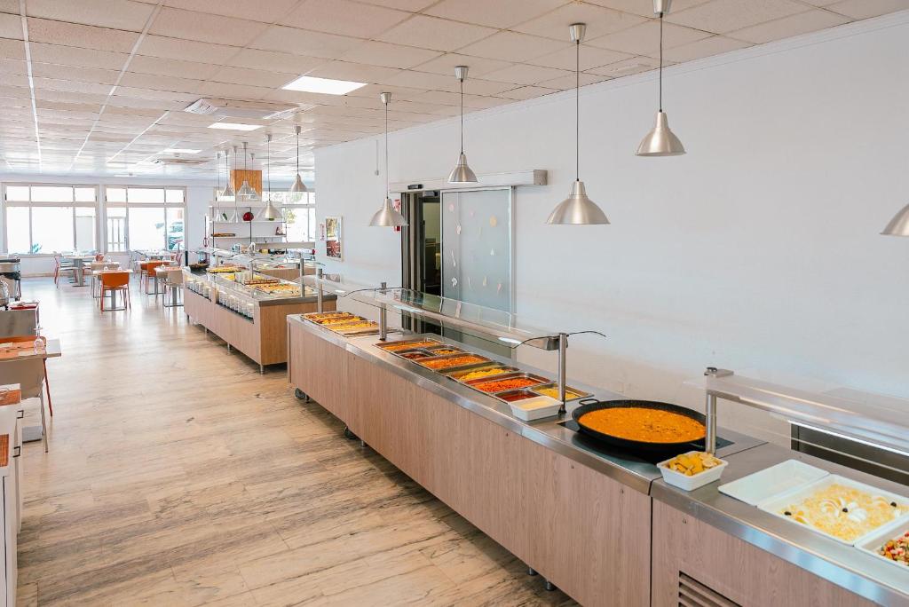 a kitchen with a bunch of food on display at Port Europa in Calpe