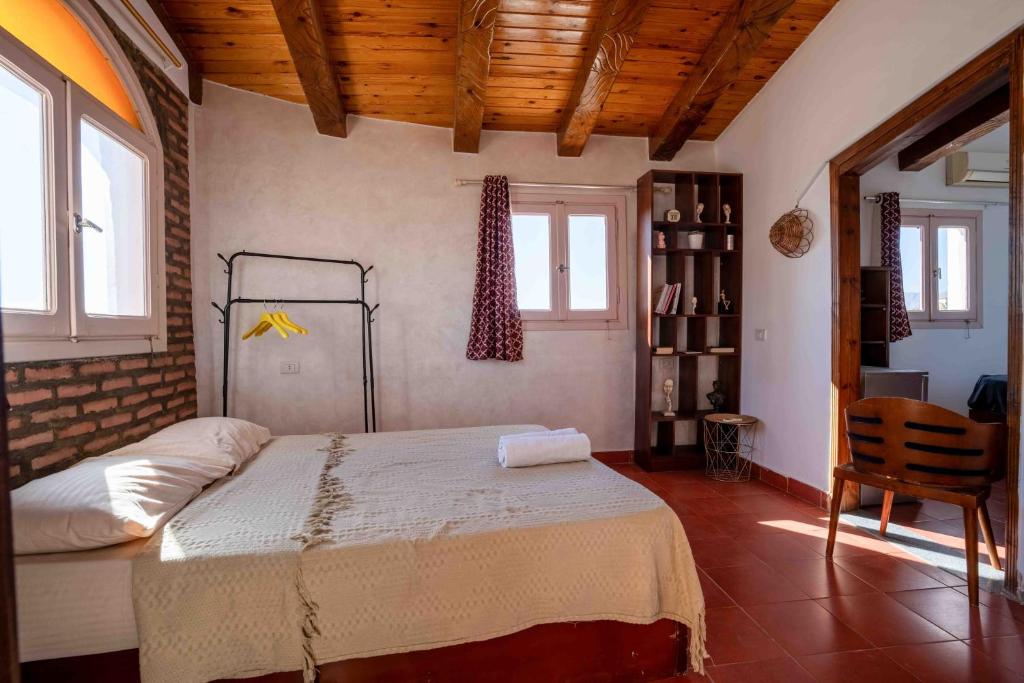 Postel nebo postele na pokoji v ubytování Elomda Seaview