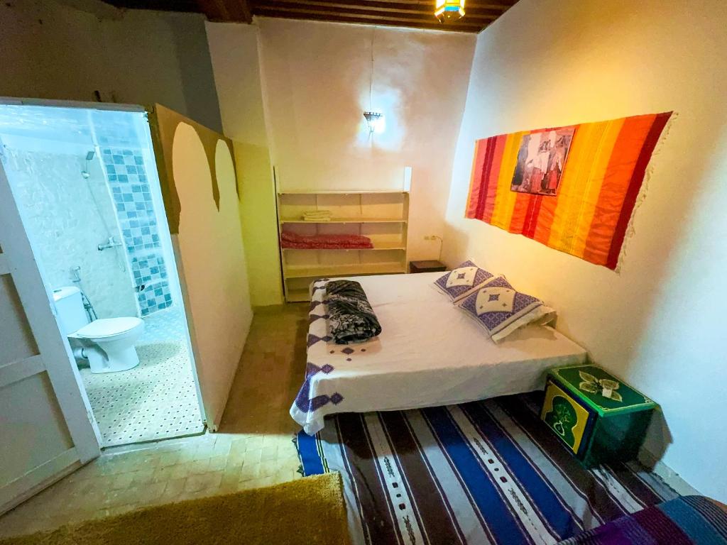 Ένα ή περισσότερα κρεβάτια σε δωμάτιο στο Maison Oqbah