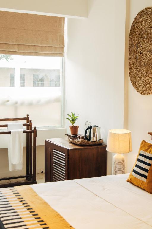 Postel nebo postele na pokoji v ubytování Neevana Hotel Hikkaduwa