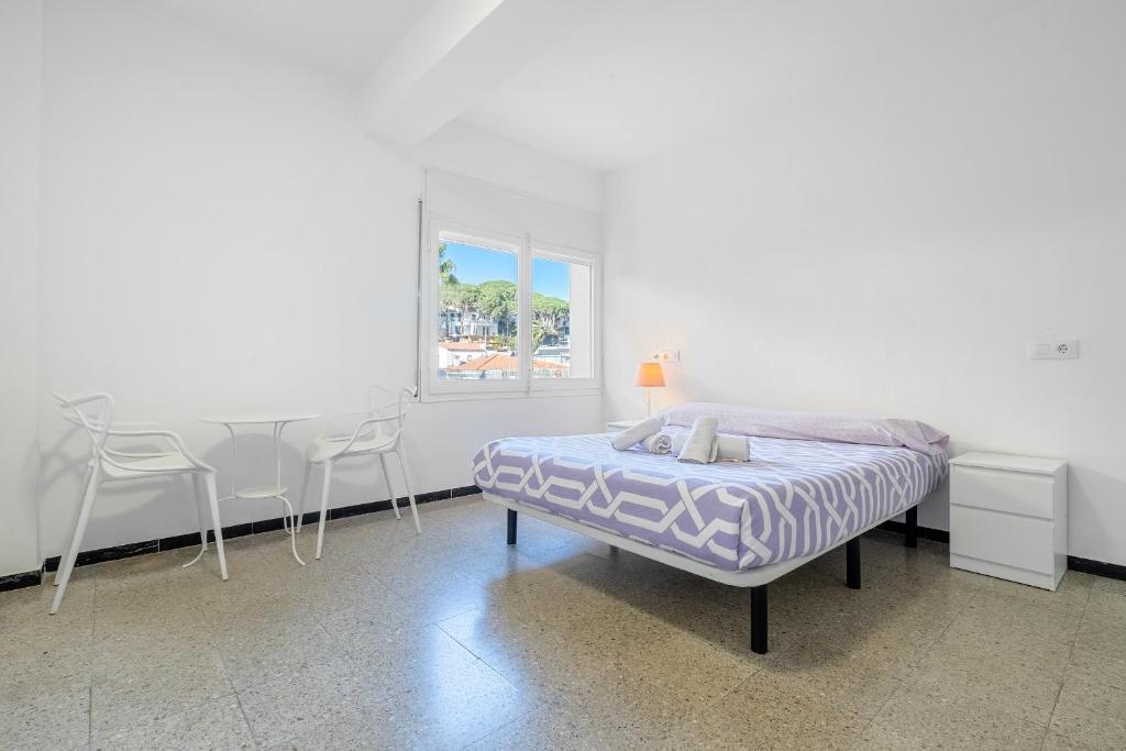 Posteľ alebo postele v izbe v ubytovaní Hauzify I Apartament Riera