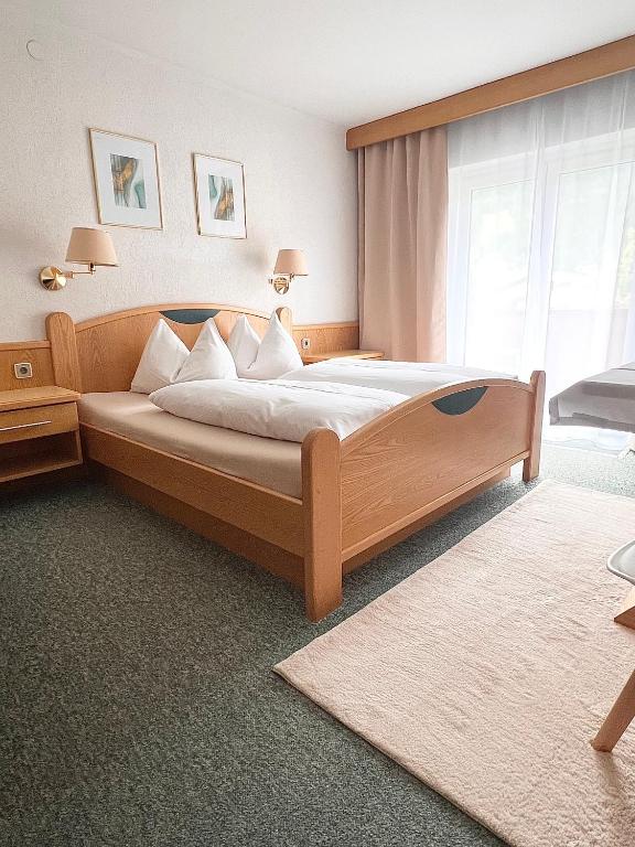 Postel nebo postele na pokoji v ubytování Frühstückspension-Appartementhaus Wasserer