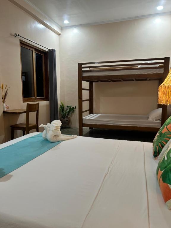 Postel nebo postele na pokoji v ubytování Yapak Beach Villas