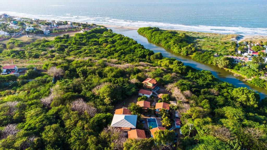 an aerial view of a house next to a river at Hostal las Cabañas Santa Veronica in Santa Veronica