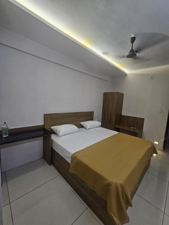 Postel nebo postele na pokoji v ubytování Regent Tourist Home