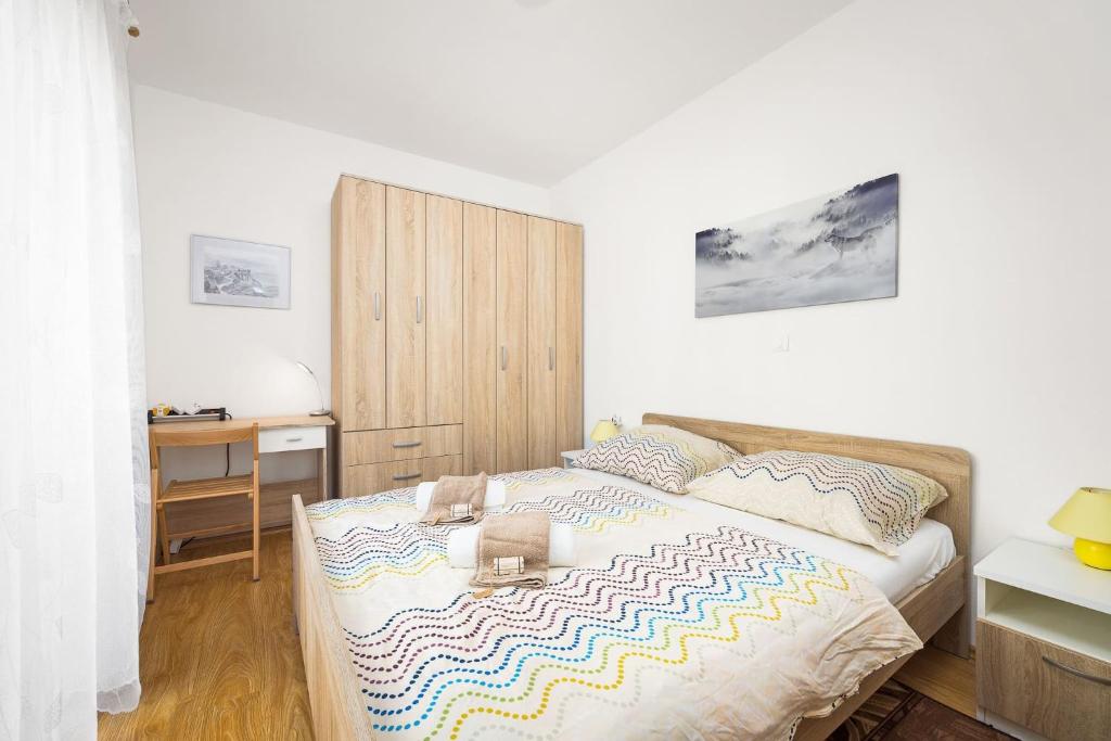 Postel nebo postele na pokoji v ubytování Apartment Tania