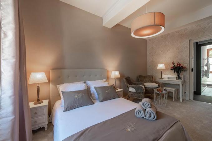 Postel nebo postele na pokoji v ubytování Hôtel Au Coq Dort Spa