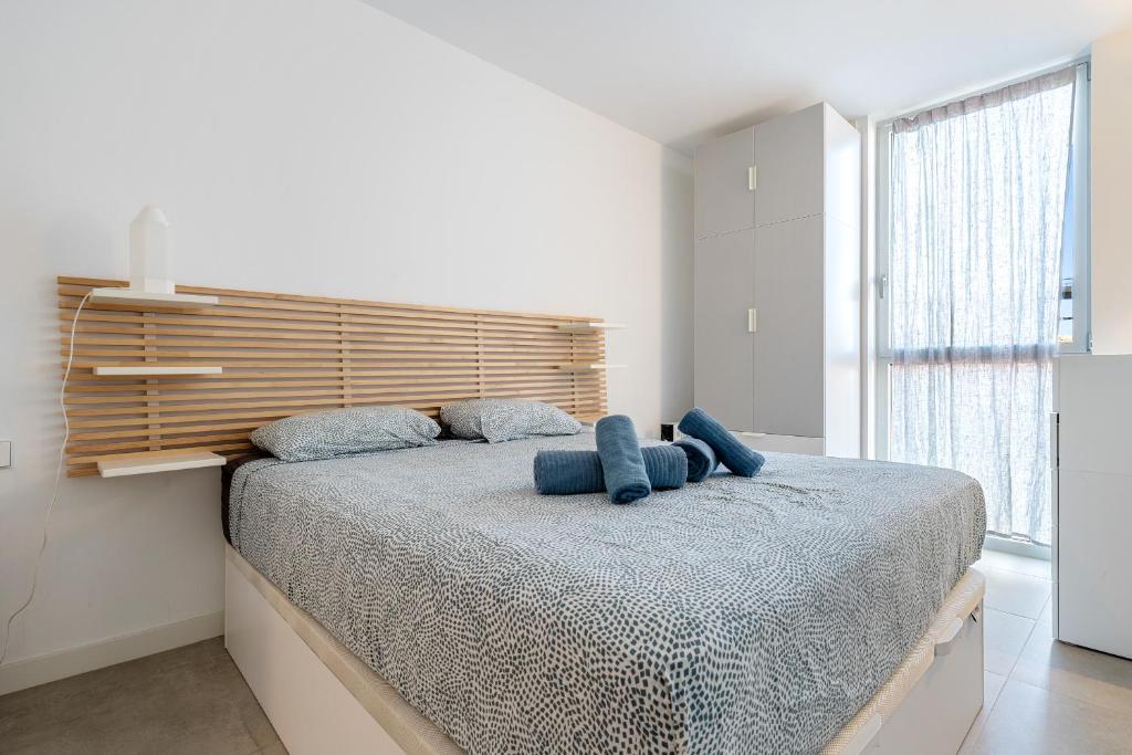 Postel nebo postele na pokoji v ubytování Hauzify I Apartament Jardins d'Aro