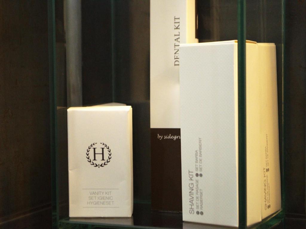 three boxes are sitting on a shelf at Hotel EMD in Bacău