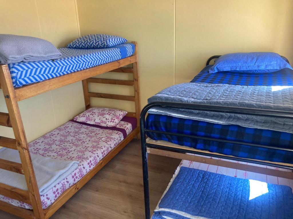 Voodi või voodid majutusasutuse Refugio El Volcán toas