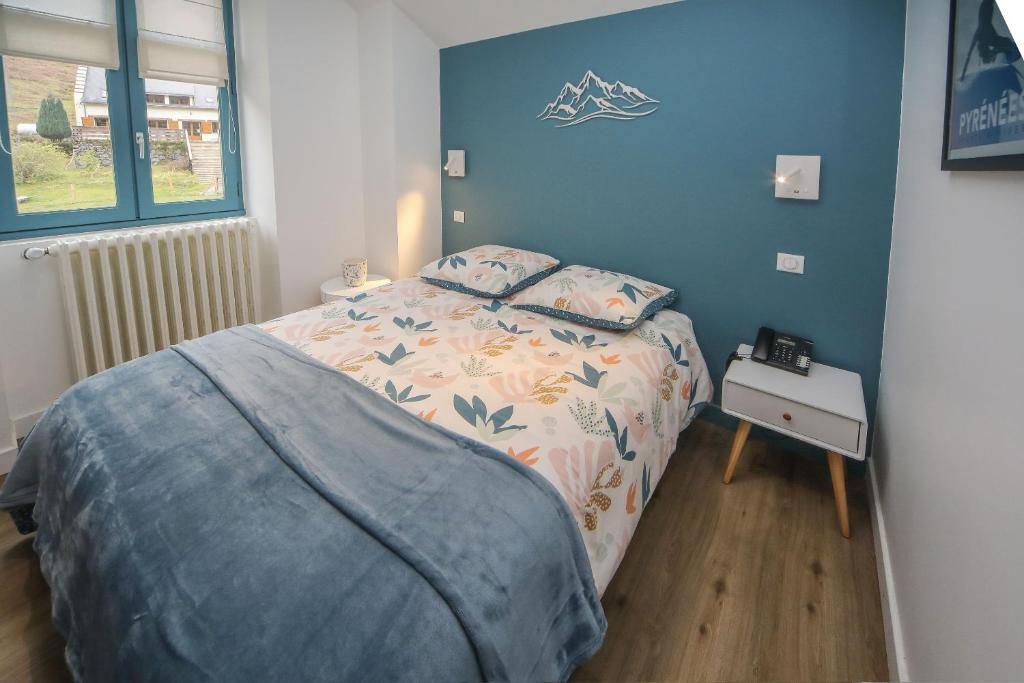 Postel nebo postele na pokoji v ubytování Hotel O Chiroulet