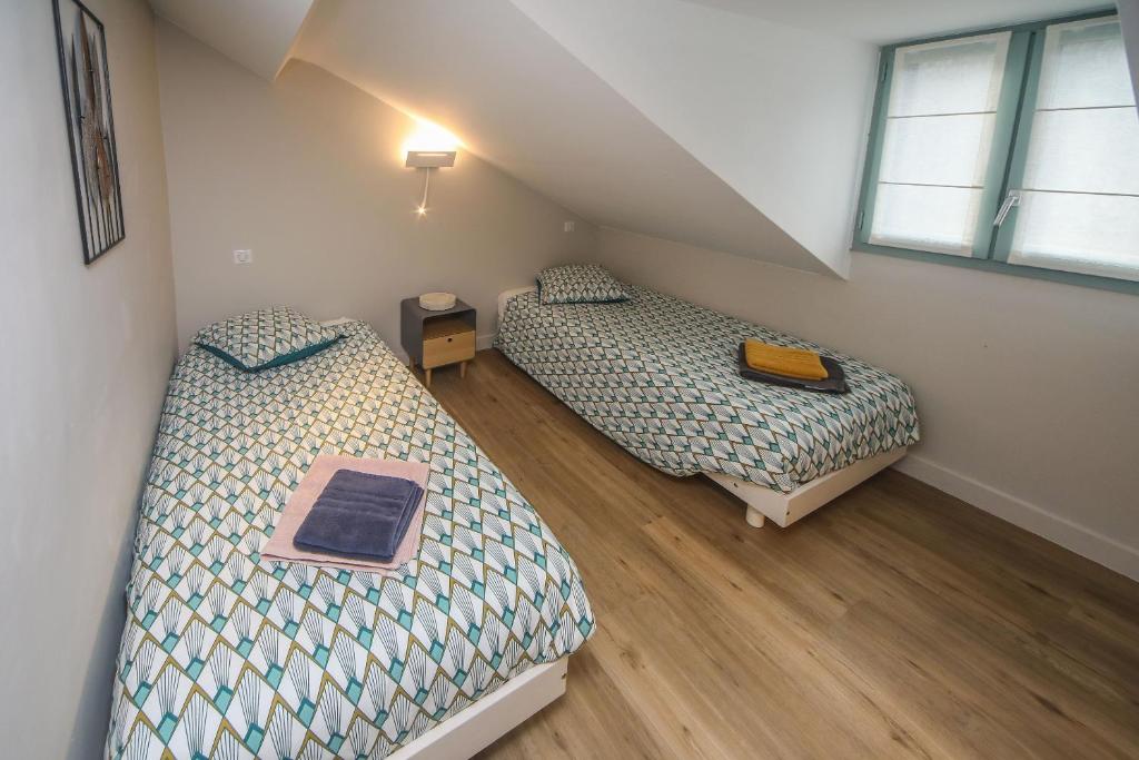 Postel nebo postele na pokoji v ubytování Hotel O Chiroulet