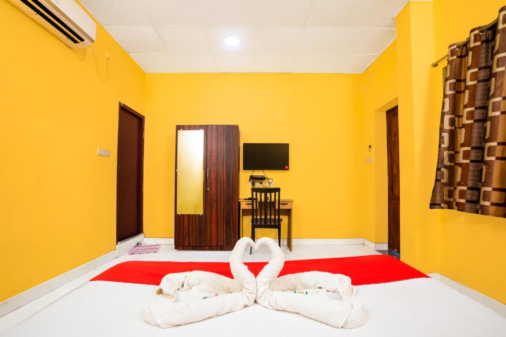 Postel nebo postele na pokoji v ubytování STARLIGHT HOTELs PUDUCHERRY