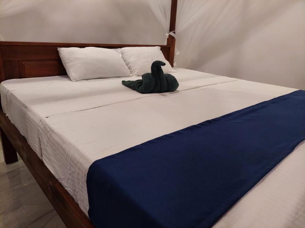 Postel nebo postele na pokoji v ubytování Sea Glow - Tangalle