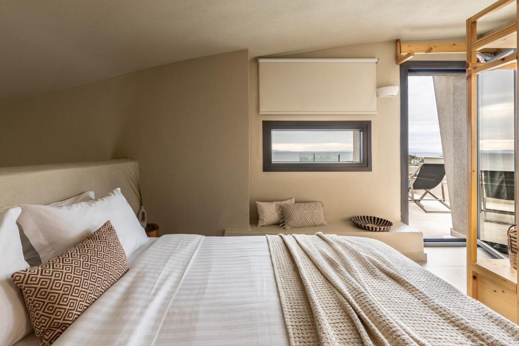 Postel nebo postele na pokoji v ubytování Fari Stone Villas