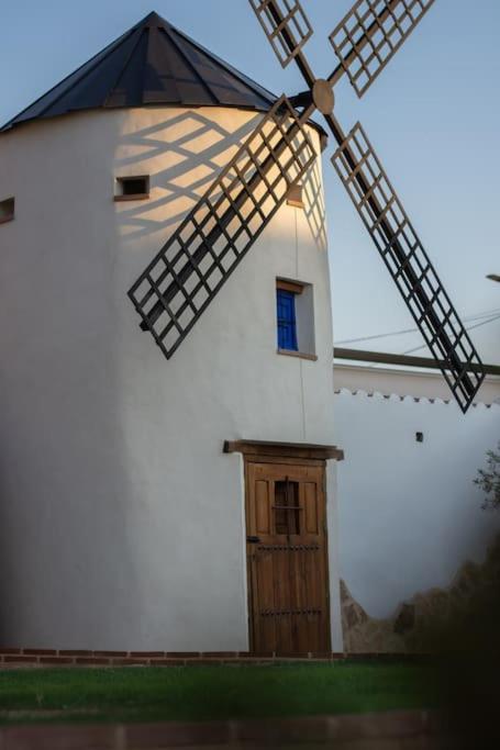 a windmill with a door and a window on it at Casa Rural La Moreneta in Las Mesas