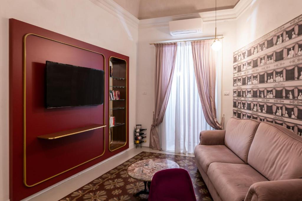 A television and/or entertainment centre at Scene Suites Apartments