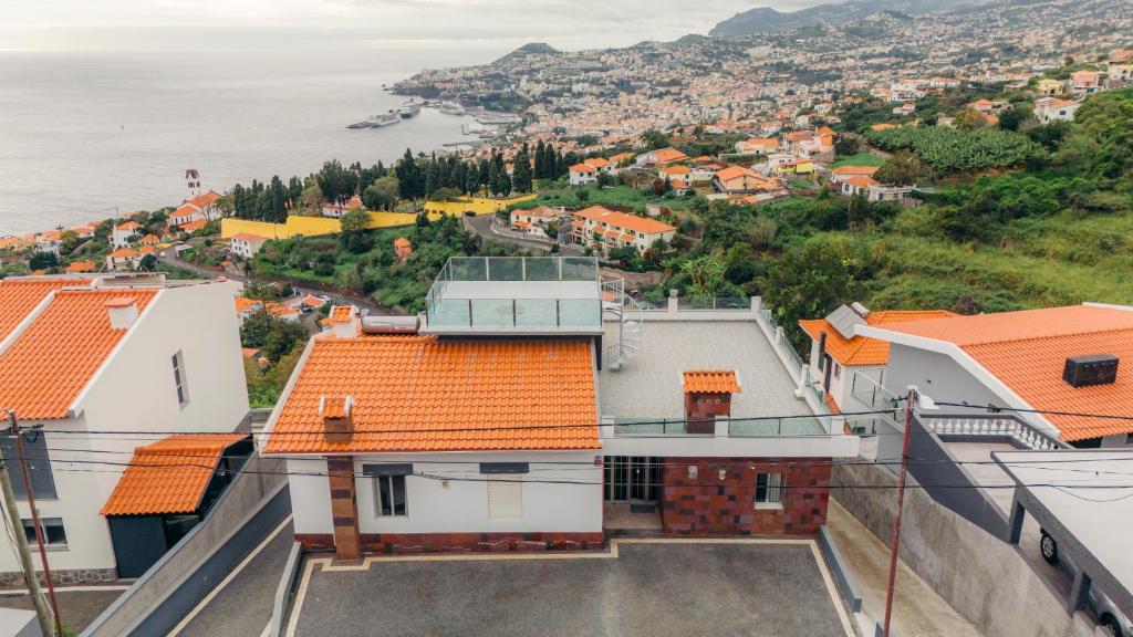 an aerial view of a city with orange roofs at Atlantic View Residence in Funchal