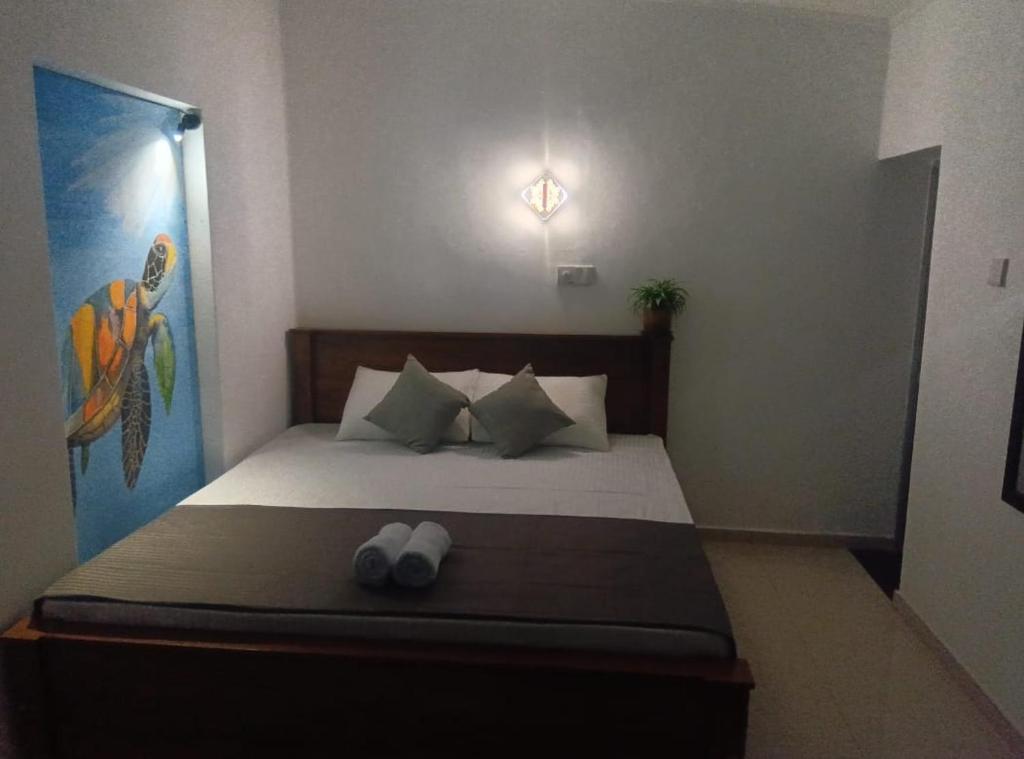 A bed or beds in a room at TaMaRiNd house