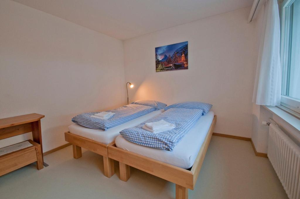 Postel nebo postele na pokoji v ubytování Haus Matten, Apartment Birch