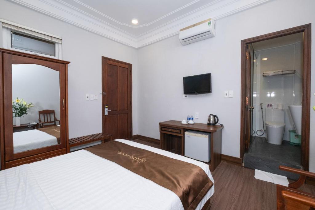 Postel nebo postele na pokoji v ubytování Jade Hotel