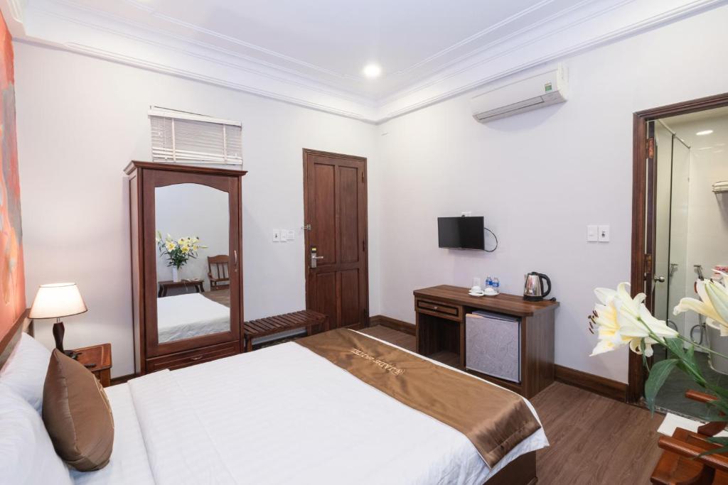 Postel nebo postele na pokoji v ubytování Jade Hotel