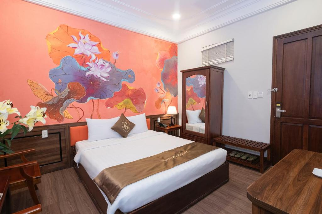 Postel nebo postele na pokoji v ubytování Jade Hotel