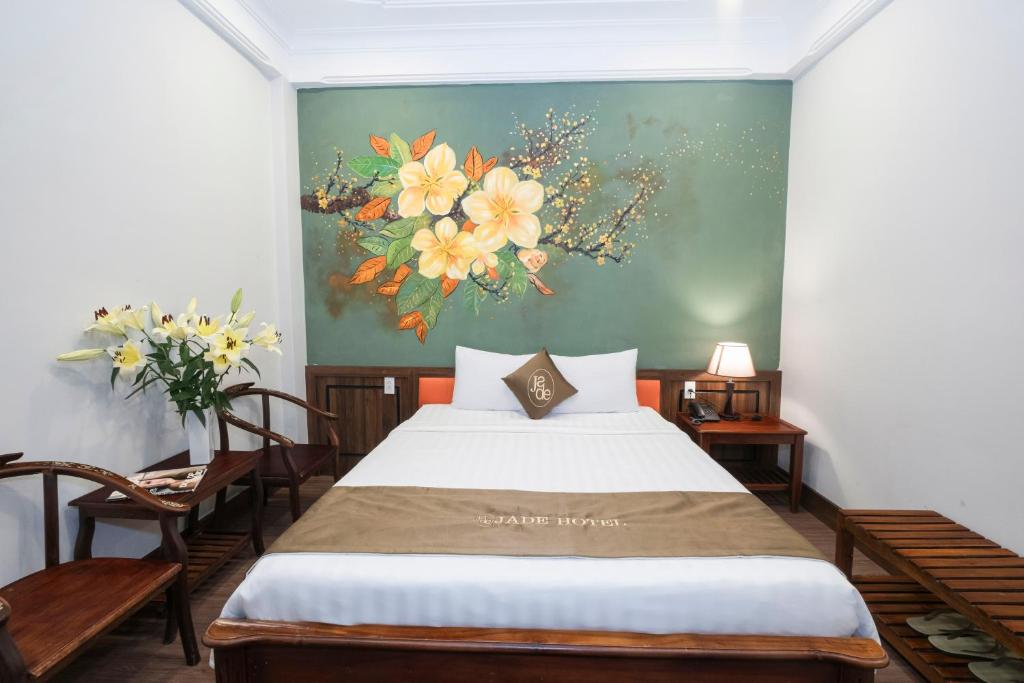 Postel nebo postele na pokoji v ubytování Jade Hotel