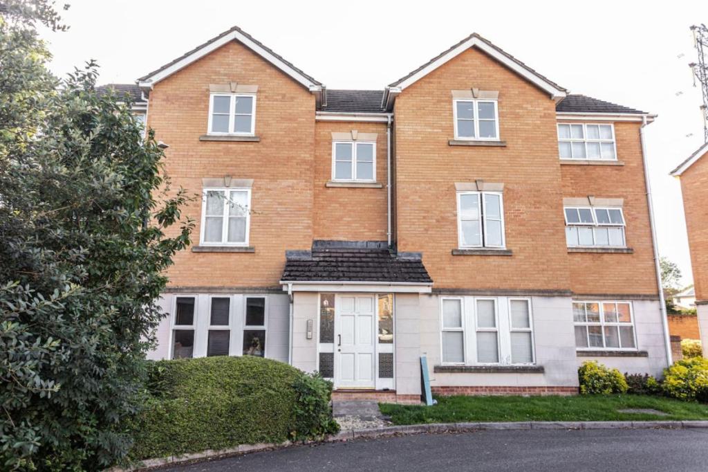 a large brick house with a white door at Thorley Apartment in North Swindon, Sleeps 4 in 2 bedrooms, Long Stay Disc, Parking in Swindon