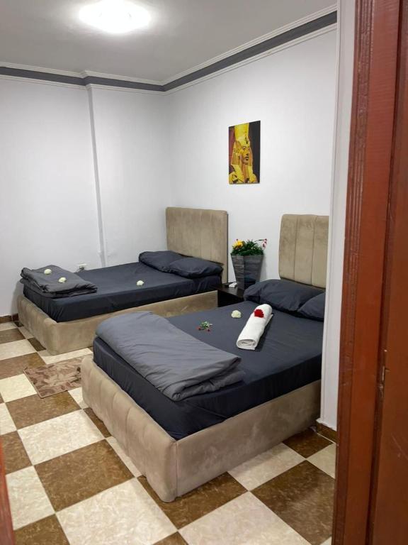 Postel nebo postele na pokoji v ubytování Pyramids International INN