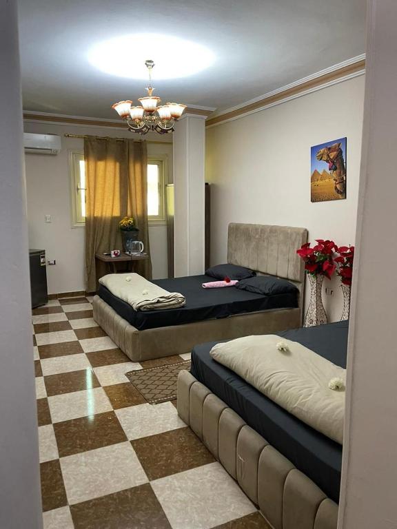 Postel nebo postele na pokoji v ubytování Pyramids International INN