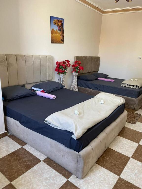 Postel nebo postele na pokoji v ubytování Pyramids International INN