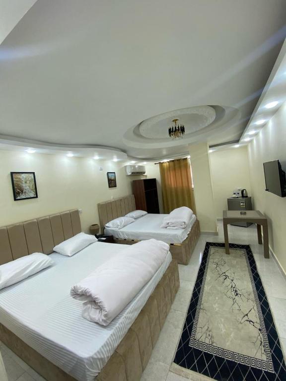 Postel nebo postele na pokoji v ubytování Pyramids International INN
