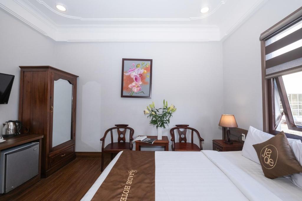 Postel nebo postele na pokoji v ubytování Jade Hotel