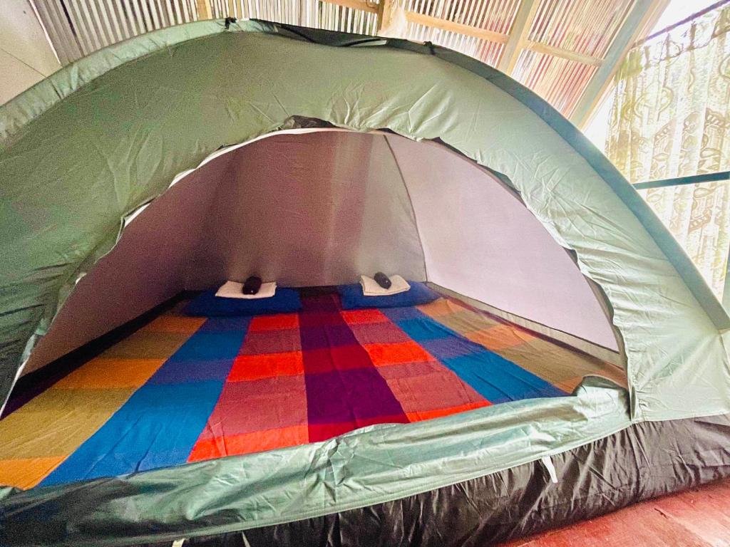 Postel nebo postele na pokoji v ubytování Sigiriya Rastha Hostel