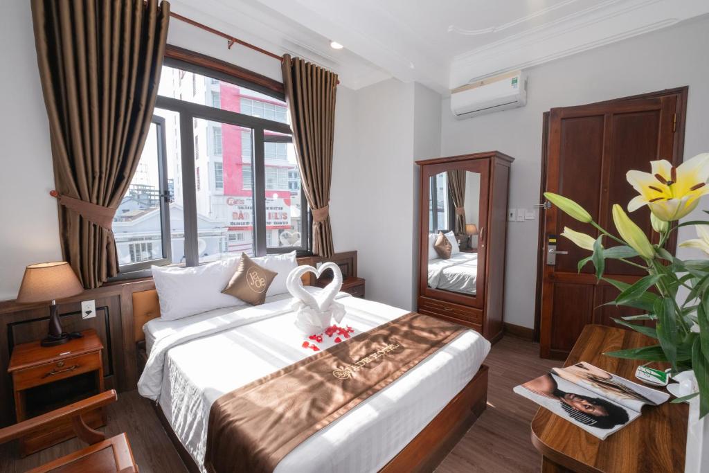 Postel nebo postele na pokoji v ubytování Jade Hotel