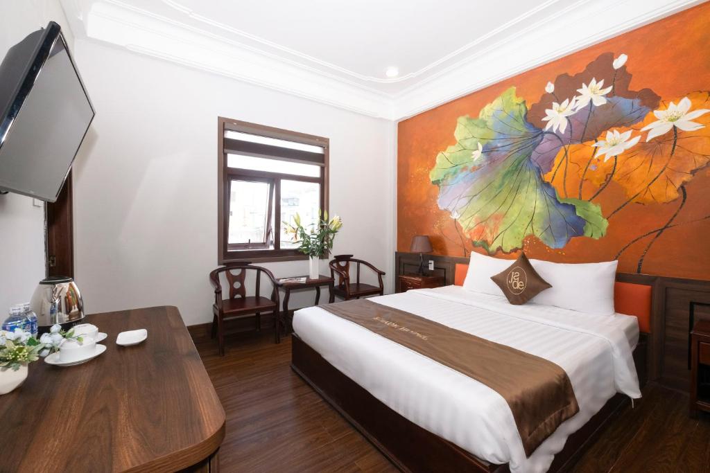 Postel nebo postele na pokoji v ubytování Jade Hotel
