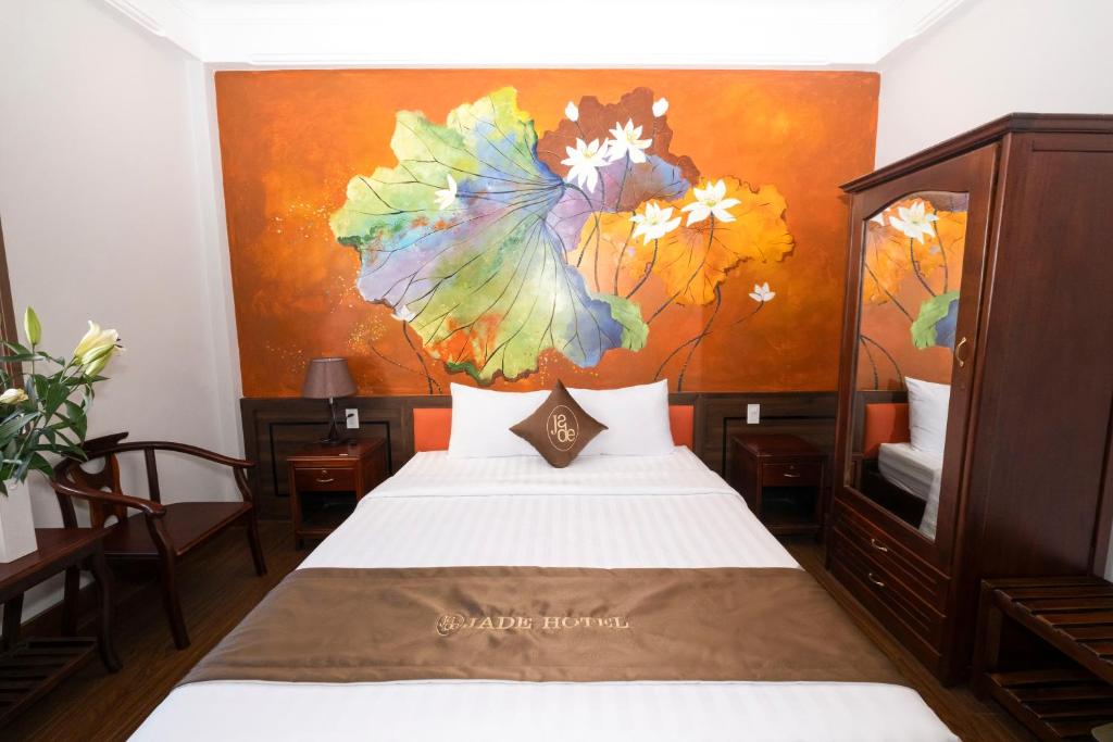 Postel nebo postele na pokoji v ubytování Jade Hotel