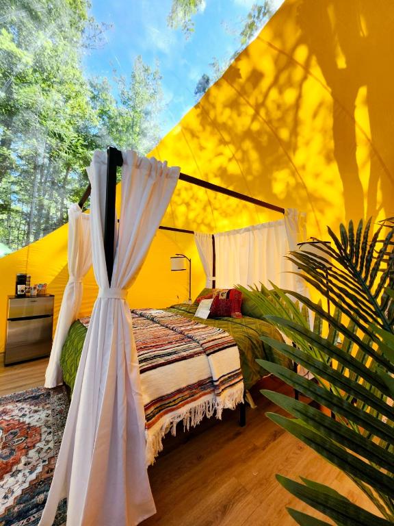 Postel nebo postele na pokoji v ubytování Estrella Glamping