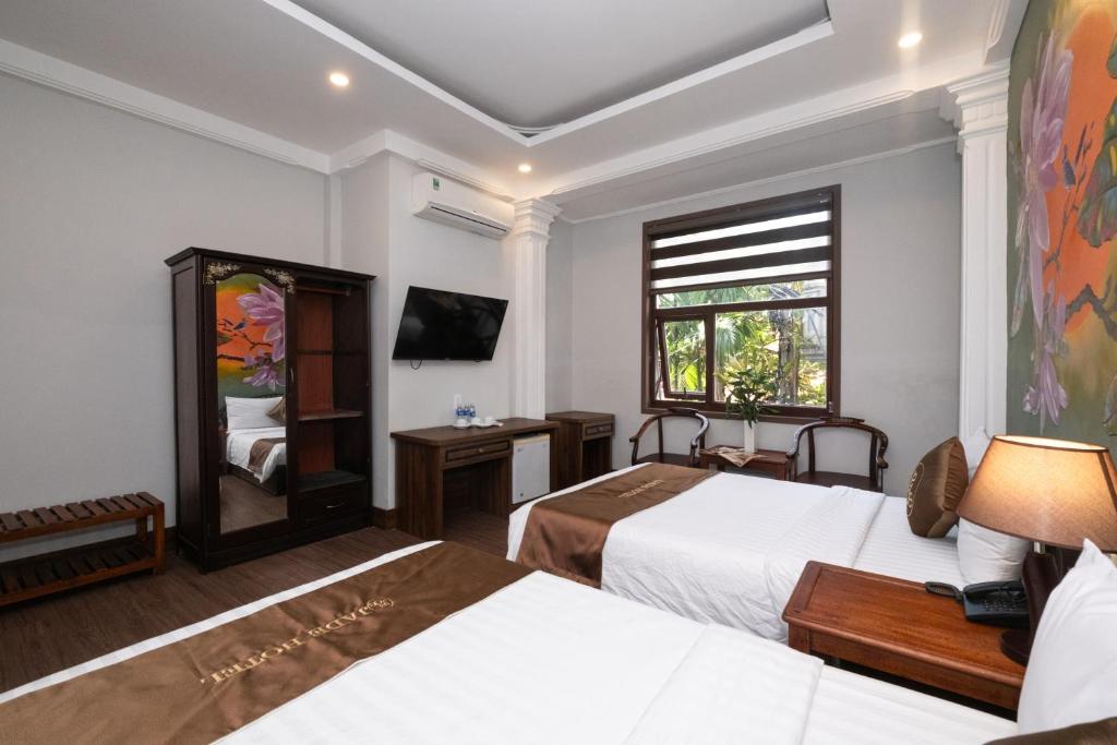Postel nebo postele na pokoji v ubytování Jade Hotel