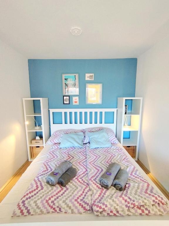 Postel nebo postele na pokoji v ubytování MOOKI Beach Apartment
