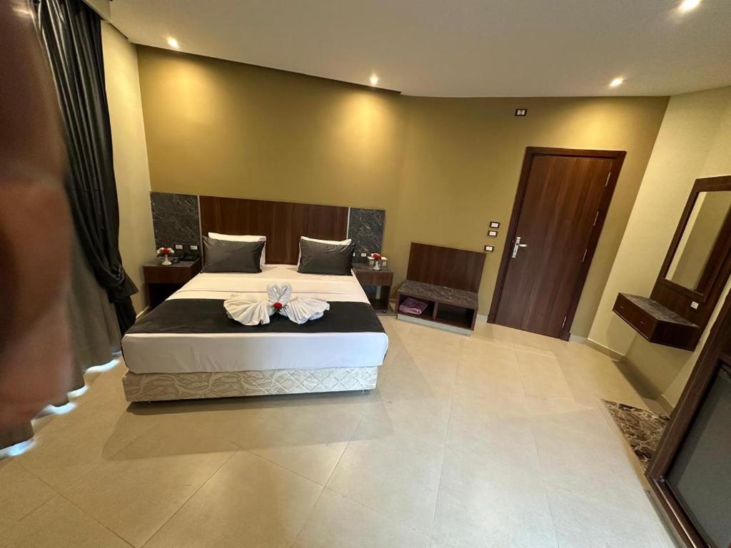 Postel nebo postele na pokoji v ubytování Sama hotel