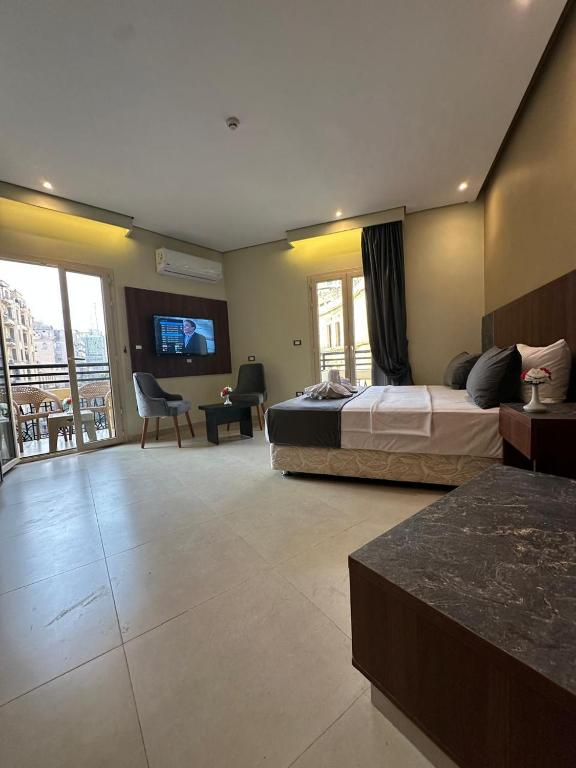 Postel nebo postele na pokoji v ubytování Sama hotel